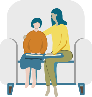 A child and adult sitting in a chair