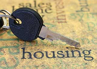 Image of a key over the word housing