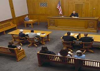Overhead image of a courtroom hearing