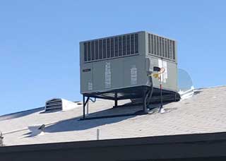 Air conditioner on house
